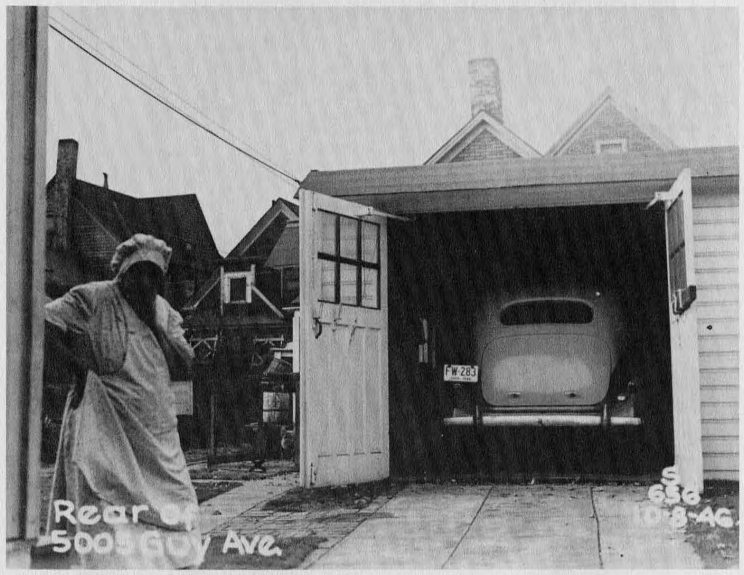 picture of woman beside garage