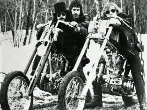 3 men know as the James Gang wearing sunglasses sitting on motorcycles