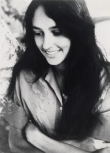 Joan Baez, smiling