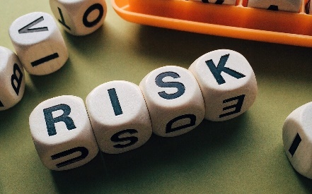 the word "Risk" spelled out with dice