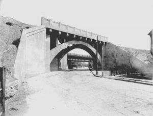 A concrete arch railroad bridge over East 92nd Street is now a part of the Cleveland area RTA system.