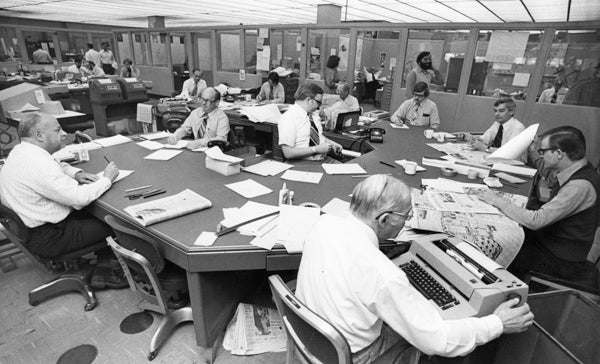 The windowless Press Copy Desk just before the age of computers. 1977. Center is Chief sub editor Dan Sabol, with deputy Bill Kjellstrand.