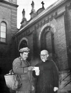 Father Ferdinand Tamburri, pastor of Holy Rosary Church and George Johnson, a mail carrier for six years in Cleveland's Murray Hill neighborhood, 1961.