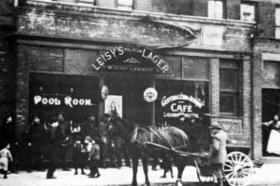 Organ Grinder in front of Guciardo's Saloon, Big Italy, circa 1900.