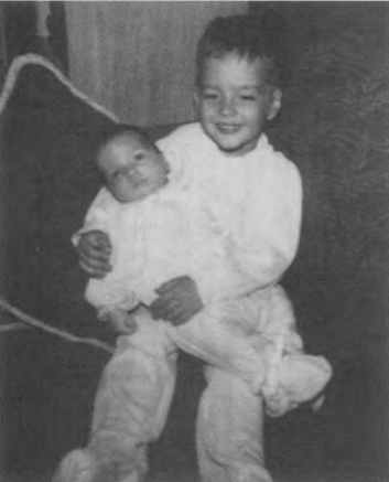 Four-year-old Edward holding infant brother Paul, 1952