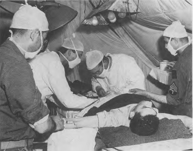 Capt. Arthur D’Alessandro, at right-center, operating in Normandy, August, 1944 Courtesy of Press Association, Inc.