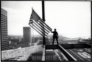 There have been many memorable photographs taken in Cleveland, but this one by Plain Dealer photographer Christine "Chris" Stephens captures the city's beauty, daring, and optimism as it entered the 1990s. For journalists, the image brings mixed emotions. It shows an iron worker atop the 20-story North Point Office Tower at E. 9th Street and Lakeside Avenue, the former site of the Cleveland Press. The Press building was demolished after the newspaper closed in 1982 and it was replaced with an office building and tower. Cleveland Public Library Photograph Collection.