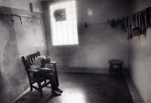 This picture of a woman in a stupor under a shower is one of many taken by William "Bill" Wynne, documenting abuse and deplorable conditions at the Lima State Hospital. Special Collections, Cleveland State University Library.