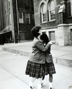 St. Peters High School students comfort each other after hearing of the death of President John F. Kennedy. Special Collections, Cleveland State University Library.