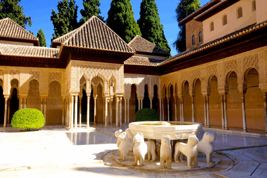 Palace of the Lions at Alhambra, photo of courtyard with fountain encircled by stone lions
