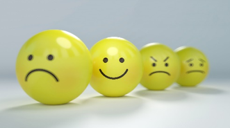 Stressballs with images of sad happy and angry faces