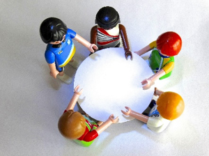 LEGO mini figures at a round table