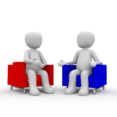 Two humanoid silhouettes seated in red and blue chairs