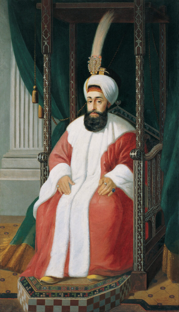 Sultan Selim III sitting on throne, dressed in red and white robe