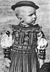 A boy in national costume from DOBRÁ NIVA - Slovakia From: SLOVENSKO vo fotografii Karola Plicku