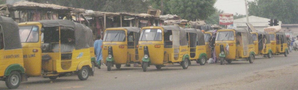 Line of parked yellow taxi-go carts